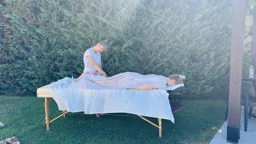 Spa therapist applying glow mask at a villa pool in Crete